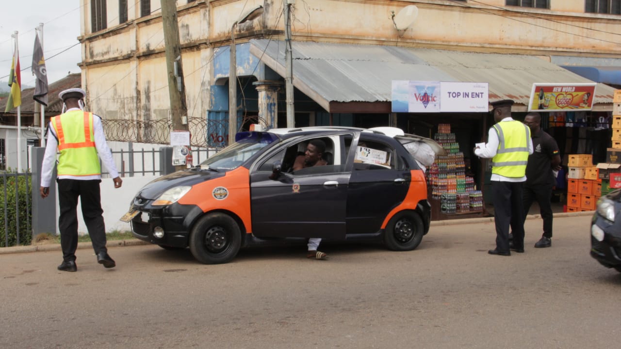 The MTTD officers subjecting a taxi to inspection