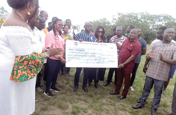 Mr Alexander Akwasi Acquah (right), MP for Akyem Oda, presenting a dummy cheque to Mr Castro Asumadu Addae, the Assembly Member for Oda Community 2 Electoral Area