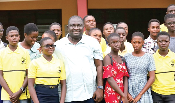 Davis Ansah Opoku — MP for Mpraeso, with some of the beneficiaries
