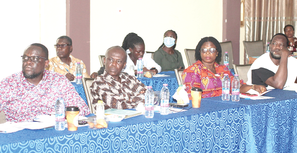 Dr Isaac Nyarko Kwakye (left), Programmes Officer, SEND Ghana, addressing the participants