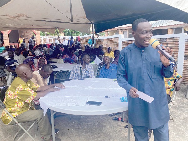  Johnson Kwaku Adu (standing), MP for Ahafo Ano South West, speaking at the get-together