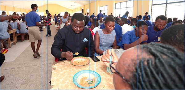 Rev. John Ntim Fordjour, Deputy Minister of Education, eating lunch with some students of St John's Grammar Senior High School. Picture: Maxwell Ocloo