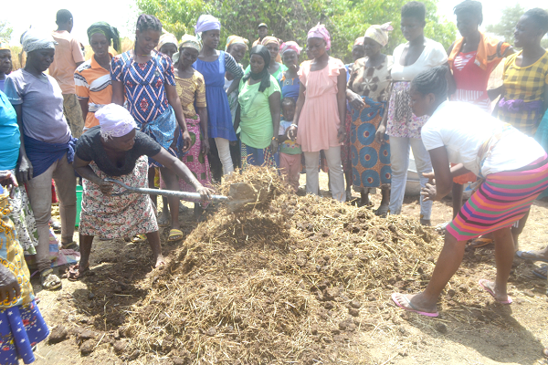  The women being taken through the organic compost production