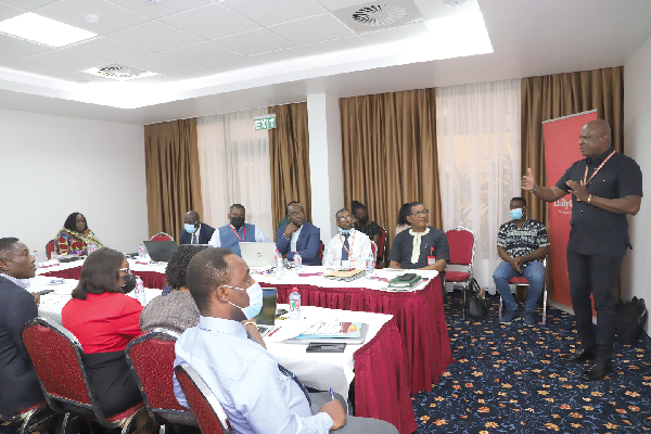 • Ato Afful (right), Managing Director of the Graphic Communications Group Limited, explaining a point at the orientation. Pictures: EDNA SALVO-KOTEY