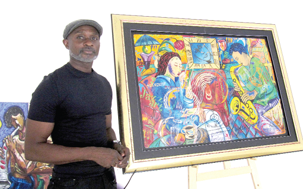 Safori standing by one of his Jazz-themed paintings