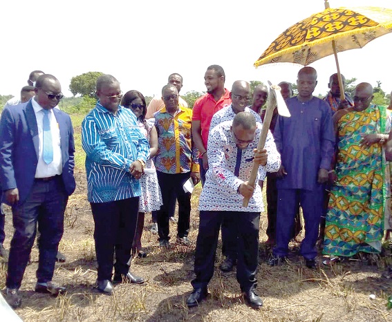 Dr Frank Serebour, President of the Ghana Medical Association, performing the sod cutting ceremony at the project site at Fiapre in the Bono Region, while officials of GMA and the traditional authority look on