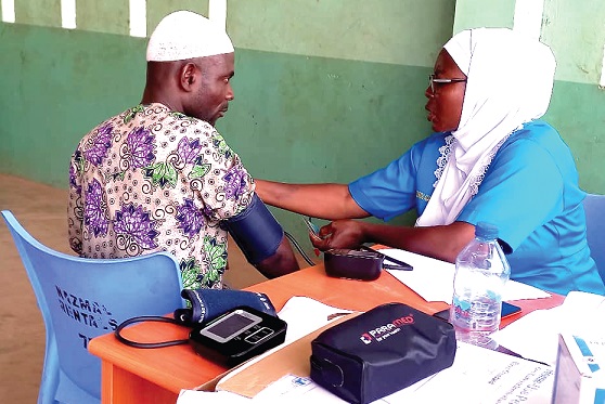 A resident being attended to by a health official during the exercise