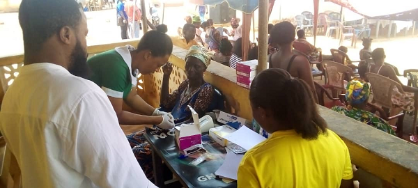 Some of the residents going through the screening process at Ekumfi Ekotsi
