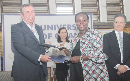 Joaquin Roura Lama (left), President of Spain-Ghana Chamber of Commerce, exchanging the documents with Professor Nana Aba Appiah Amfo (right), Vice-Chancellor, University of Ghana, after signing. Behind them is Javier Gutierrez, Spanish Ambassador to Ghana. Picture: BENEDICT OBUOBI