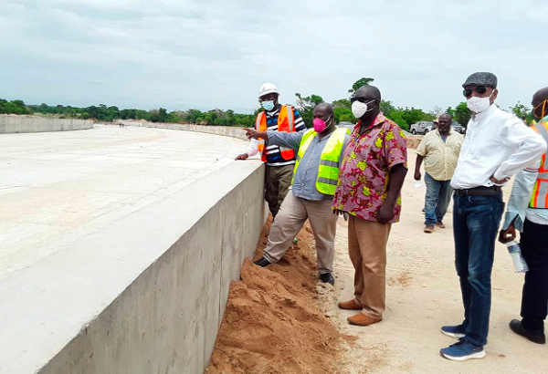 Philip Daniel Laryea (middle), the Operations Manager of GCAP, briefing stakeholders on the rehabilitation works of the Tono Irrigation Scheme