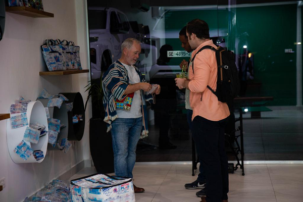 Chief Executive Officer of Trashy Bags Africa, Mr Philip Foster(left), speaking  to some visitors at  the opening