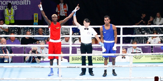 Joseph Commey (left) being adjudged winner of the bout