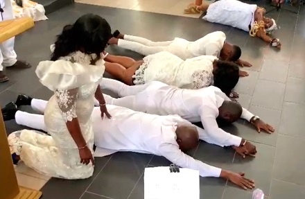  Stephen Ayesu Ntim ( 2nd  from left on the floor), the National Chairman of the New Patriotic Party, and some members of his family praying to God at the St Peter’s Methodist Church at Achimota Mile 7 in Accra