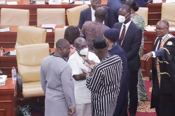 • Haruna Iddrisu (back to camera), the Minority Leader, interacting with Ken Ofori-Atta (left), the Minister of Finance, after the budget presentation. Picture: GABRIEL AHIABOR