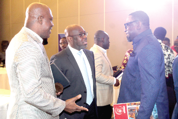  Ato Afful (left), MD, Graphic Communications Group Limited, interacting with Humphrey Ayim-Darke (right), Chief Executive Officer, RedMoon Resources Limited, and Kwamina Asomaning, Chief Executive, Stanbic Bank. Picture: ESTHER ADJORKOR ADJEI