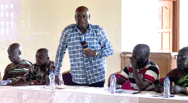 Collins Augustine Ntim (with mic),  Deputy Minister of Local Government, Decentralisation and Rural Development, addressing the meeting 