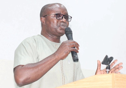 Osei Assibey Antwi, Executive Director, National Service Scheme, addressing some national service persons at the forum.