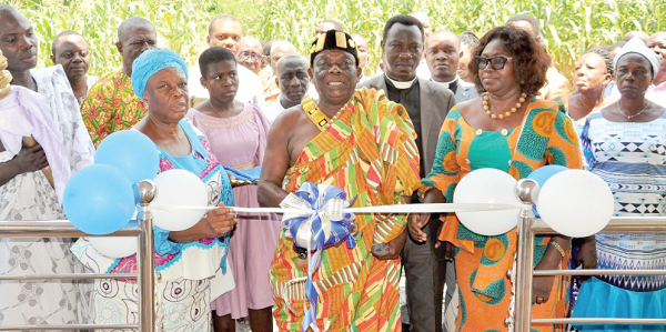 Togbega Addae Kwasi Dzani XIII, Paramount Chief of Awudome, being assisted by Stella Mawusi Mawutor (right), the Eastern Regional Director of Social Welfare, and Edith Saviour Asem (left) to inaugurate Mount Saviour Foundation’s training centre