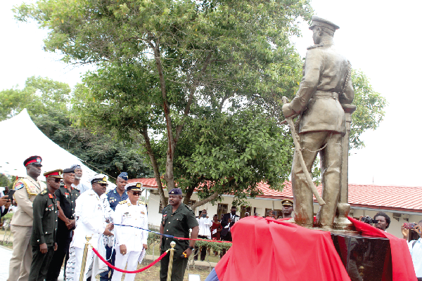 Vice-Admiral Seth Amoama (left), Chief of the Defence Staff, officially unveiling the General J.A. Ankrah statue. With him are Rear Admiral M. Beick-Baffour (2nd from right), Commandant, Ghana Armed Forces Command and Staff College, and some other officials.  Picture:  ESTHER ADJORKOR ADJEI
