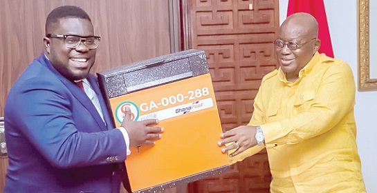 Flashback: President Nana Addo Dankwa Akufo-Addo receiving the first scuttle box from Bice Osei Kuffour (left), MD, Ghana Post
