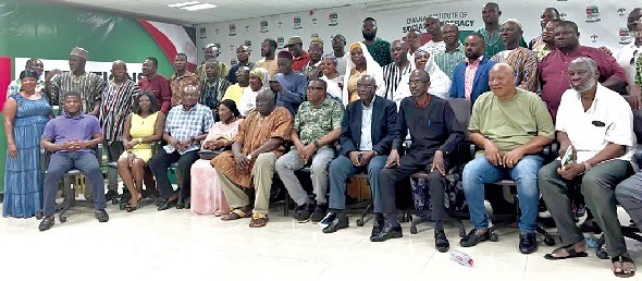 The high powered delegation and  feuding parties after the meeting. They include Johnson Aseidu Nketia (seated 3rd from right), General Secretary  of the party, and Samuel Ofosu Ampofo (middle), National Chairman  
