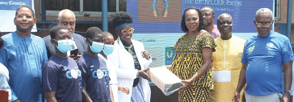 Lady Marieme Jamme (4th from left), Founder of LamtheCode, presenting computer kits to  Elizabeth Naa Kwatsoe Tawiah Sackey (3rd from right), Chief Executive of the Accra Metropolitan Assembly. Picture: ESTHER ADJORKOR ADJEI