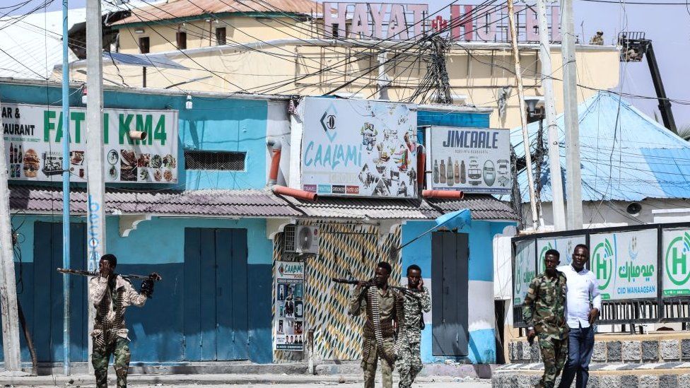 Security forces patrol near the entrance of the Hayat Hotel in Mogadishu