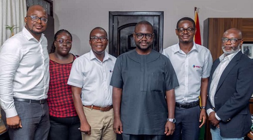 The team from the International Facility Management Association Ghana Chapter in a group picture with Francis Asenso-Boakye (3rd right), Minister of Works and Housing.