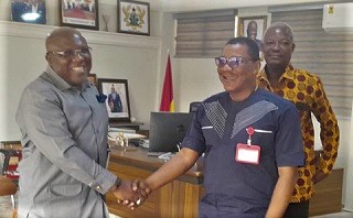 Kobby Asmah (right), Editor of the Daily Graphic, being welcomed by Seth Kwame Acheampong, Eastern Regional Minister, to his office.  With them is George Folley, regional correspondent of the Graphic
