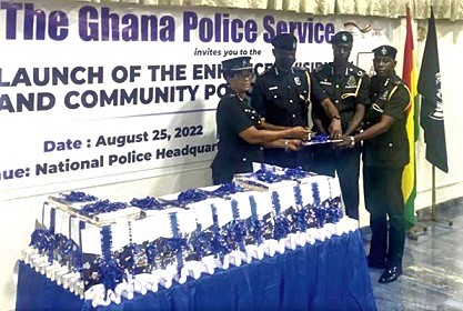 COP Paul Manly Awini  (2nd from left), Director-General of the National Patrol Department of the Ghana Police Service, being assisted by other senior police officers to launch the document