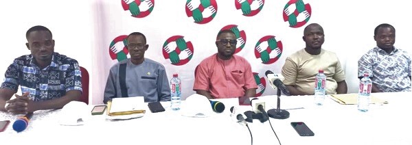 Osei Kofi Acquah (middle), General Secretary of the Coaltion, speaking at the press conference. With him are the other youth organisers of the political parties 