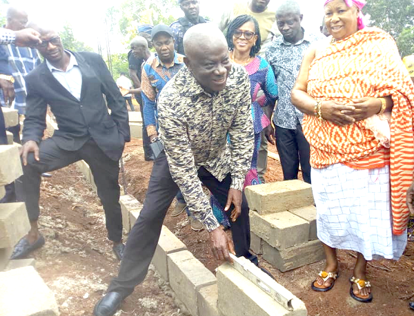 George Yaw Boakye, Ahafo Regional Minister, laying a block for the construction of a three-unit classroom block for the Ohianimguase DA Primary School