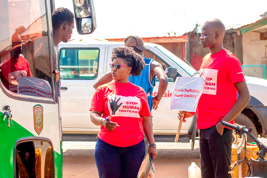  Some of the demonstrators sensitising a bus driver to the crime of human trafficking