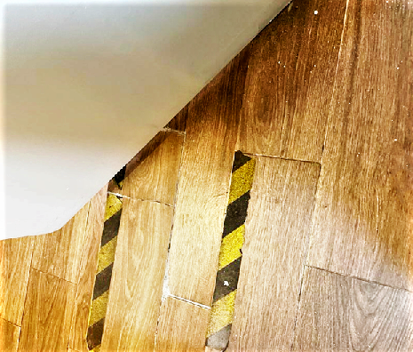 A step behind the door to a restaurant’s bathroom — a perfect trip hazard