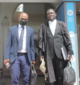  Richard Amo-Hene (left), plaintiff, with Theophilus Tawiah, his lawyer, after the judgment. Picture: ERNEST KODZI