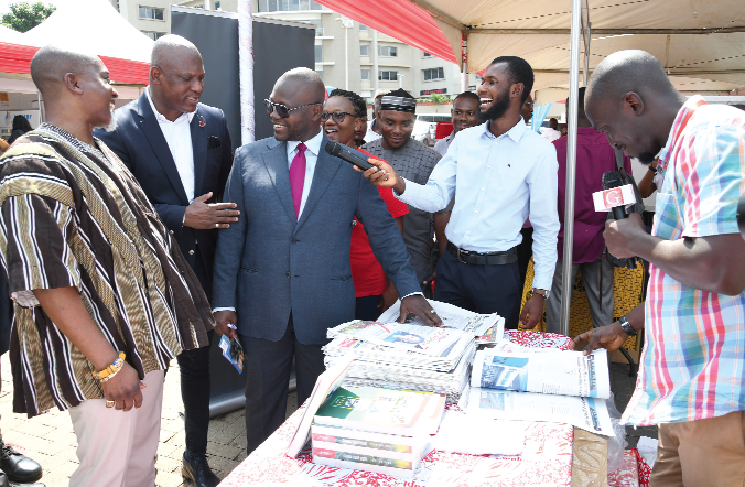  Ato Afful (2nd from left), Managing Director of Graphic Communications Group Limited (GCGL), showing some copies of the Daily Graphic to Francis Asenso-Boakye (3rd from left), Minister of Works and Housing, at the Graphic Stand at the GREDA-Graphic Housing Fair in Accra. Those with him are  Patrick Ebo Bonful (left), President of GREDA; Lelia Pentsil (3rd from right), Communications Manager, Republic Bank, and Derrick Abeiku Hanson (right), Assistant Sales and Circulation Manager of GCGL. Picture: EBOW HANSON 