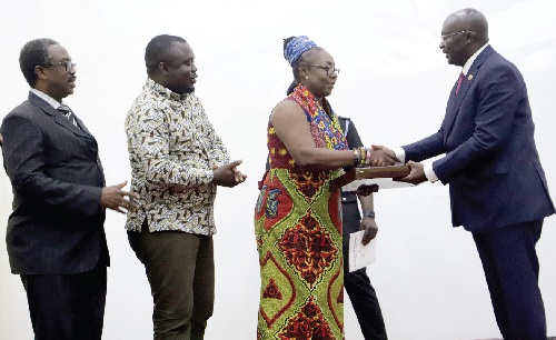 Dr Mahamudu Bawumia (right) presenting a citation to Nana Serwah Ofori-Akuamoah, Group Human Resource Director, First Sky Group. With them are Prof. Sampson Antwi (left), President, Ghana Kidney Association, and Michael Tetteh--Ocloo (left), Group Executive Secretary of the company.  Picture: SAMUEL TEI ADANO