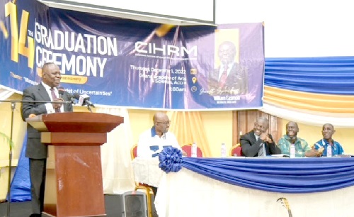 Dr Edward Kwapong delivering his speech, while Dr Ebenezer Agbettor, William Easmon,  Leo Quacoopome (Vice-President of CIHRM) and Paul Nartey, Board member of the Certification board, look on.