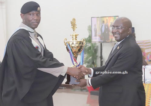 Dr Mahamudu Bawumia (right) presenting a trophy to Major Raymond Owusu-Ababio, the Overall Best Graduate of the Senior Command and Staff and International Course 43 and Master of Science In Defence and International Politics. Picture: SAMUEL TEI ADANO