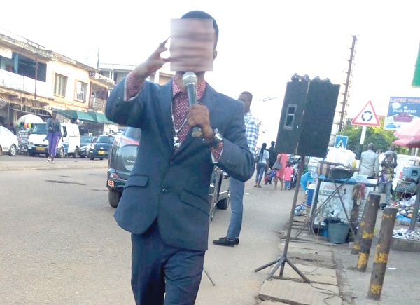 A street evangelist busy preaching the gospel