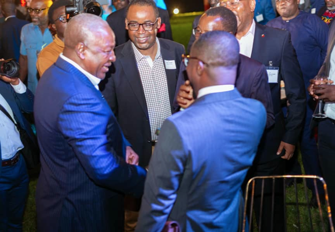 Former President John Dramani Mahama (left) interacting with some CEOs at the cocktail