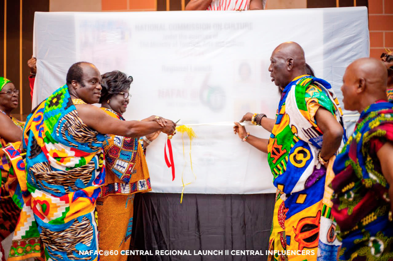 Osabarima Kwesi Atta II (2nd from right), Omanhen of Oguaa Traditional Area, Osagyefo Kwame Akonu X (left), the Paramount Chief of Anyan-Abaasa Traditional Area, and Janet Edna Nyame, the Executive Director of the National Commission on Culture, unveiling the banner for the NAFAC 2022 celebration