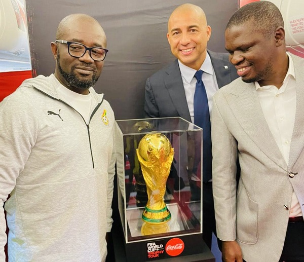 From L-R: Kurt Okraku, GFA President; David Trezeguet and Mustapha Ussif, Sports Minister posing with the World Cup trophy.