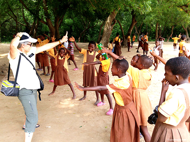  Children with a volunteer at a playground