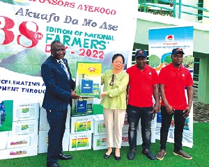 Rachel Yang, Marketing Manager of the company, presenting the items to Yaw Frimpong Addo, Deputy Minister of Food and Agriculture in charge of Crops 