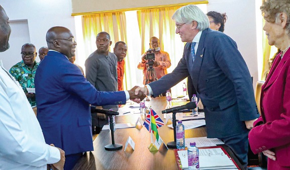 Dr Mahamudu Bawumia (left) exchanging pleasantries with  Andrew Mitchell, the UK Minister of State for Development and Africa