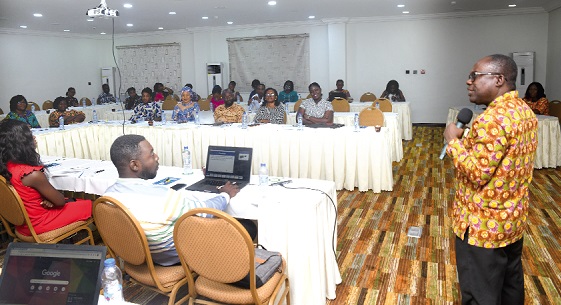  Prof. Stephen Owusu Kwankye (right), Associate Professor of the Regional Institute for Population Studies at the University of Ghana, addressing participants in the 2nd Bi-Annual Tracking Meeting on the implementation of the Adolescent Pregnancy Strategy in Accra
