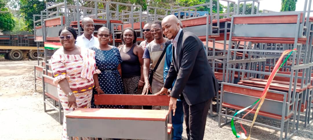  Yohane Armah Ashitey (right) MCE, Tema Metropolitan Assembly, handing over the dual desk to Bernice Ofori (left), Director of Education, Tema. With them are some officials  of the GES and TMA. Picture: BENJAMIN XORNAM GLOVER