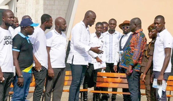 Nicholas Antwi (arrowed), the course leader, presenting the benches on behalf of the students to Joseph Yankey, Assistant Director of Prison 