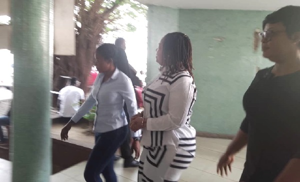 Agradaa (middle) being  escorted to the court room by some police officers